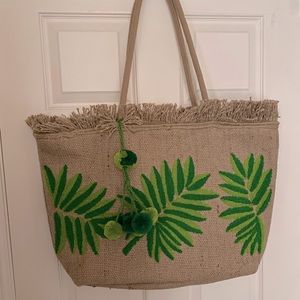 NWOT straw and fabric lined tote.